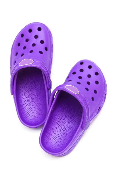在白色背景上的紫色橡胶鞋 — 图库照片