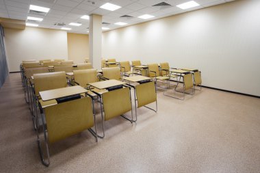 beautiful wooden desks in the modern school clipart