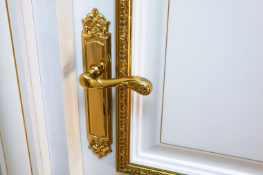 white door with the old gold handle clipart