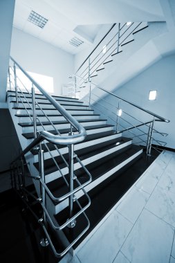 Staircase with a steel handrail clipart