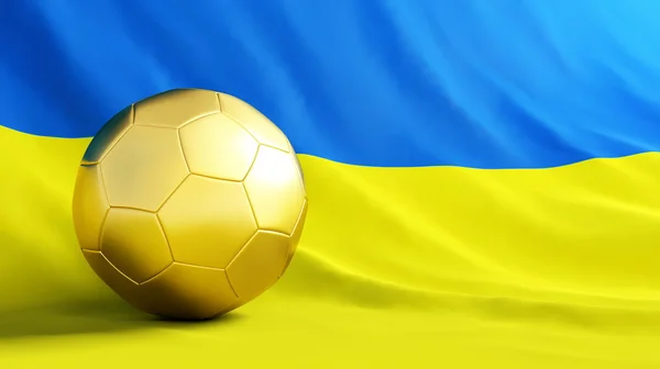 Золотой мяч на фоне украинского флага — стоковое фото