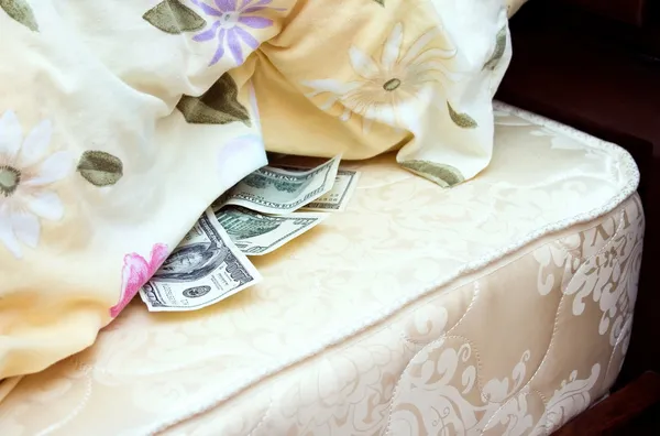 stock image Money tucked away under a pillow