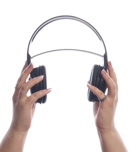 Händer med hörlurar — Stockfoto
