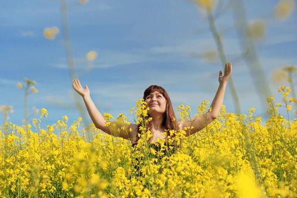 stock image Happy girl in flower meadow.