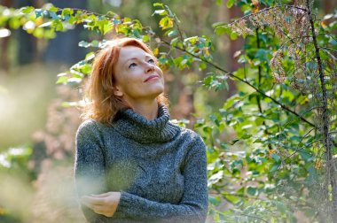 Portrait of woman in nature clipart