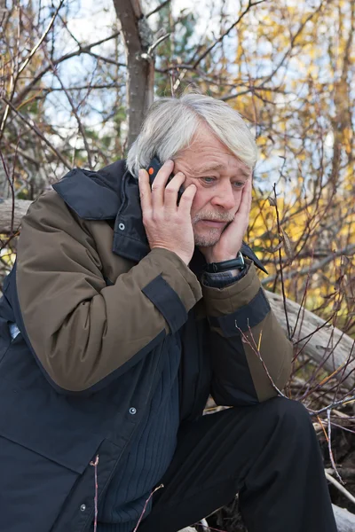 Mature middle-aged man in forest. — Stock Photo, Image