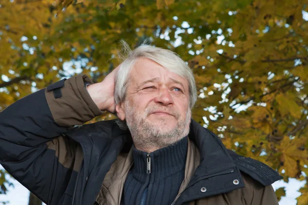 Portrait of middle-aged man in autumn day. — Stock Photo, Image