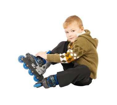 Little beautiful baby boy on roller skates clipart