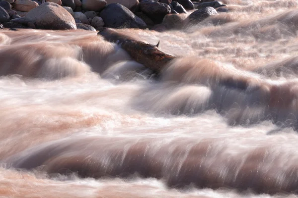 Muddy rough mountain stream — Stock Photo, Image