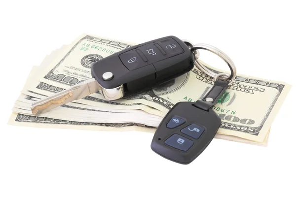 Geld en auto sleutels — Stockfoto