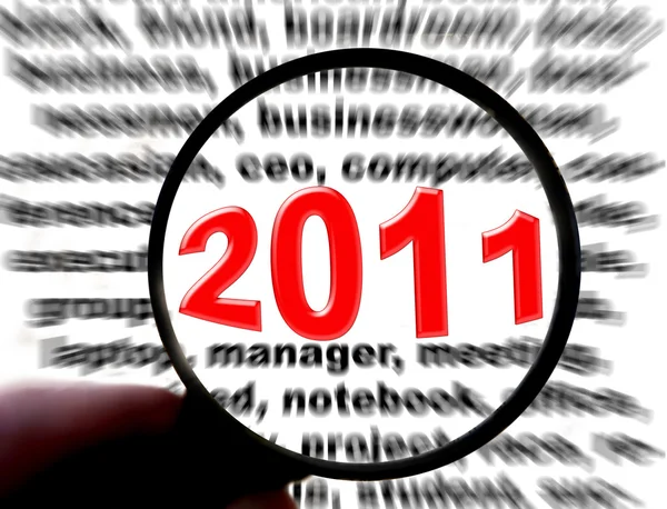 2011 with magnifying glass — Stock Photo, Image