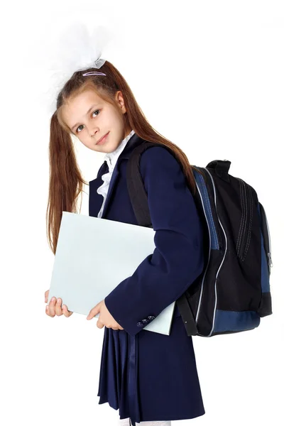 Menina com mochila e livro — Fotografia de Stock