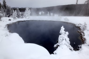 Winter season at hot lake of Yellowstone National Park, USA clipart