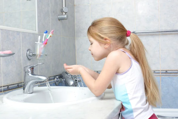 Little girl washing in bathroom — Stock Photo, Image