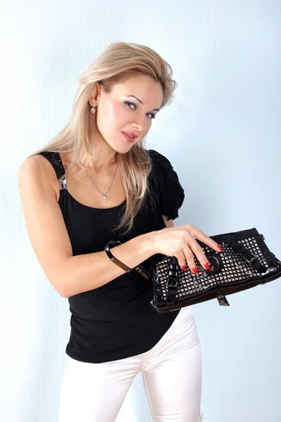 Fashion young woman with clutch bag — Stock Photo, Image