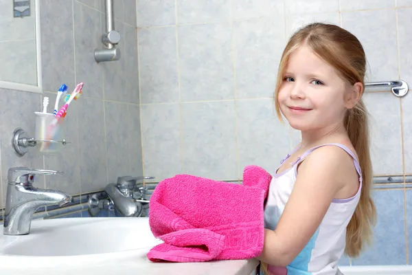 stock image Little girl taken towel after washing in bathroom