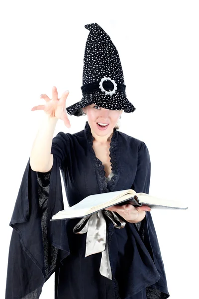 Witch met boek geïsoleerd op wit — Stockfoto
