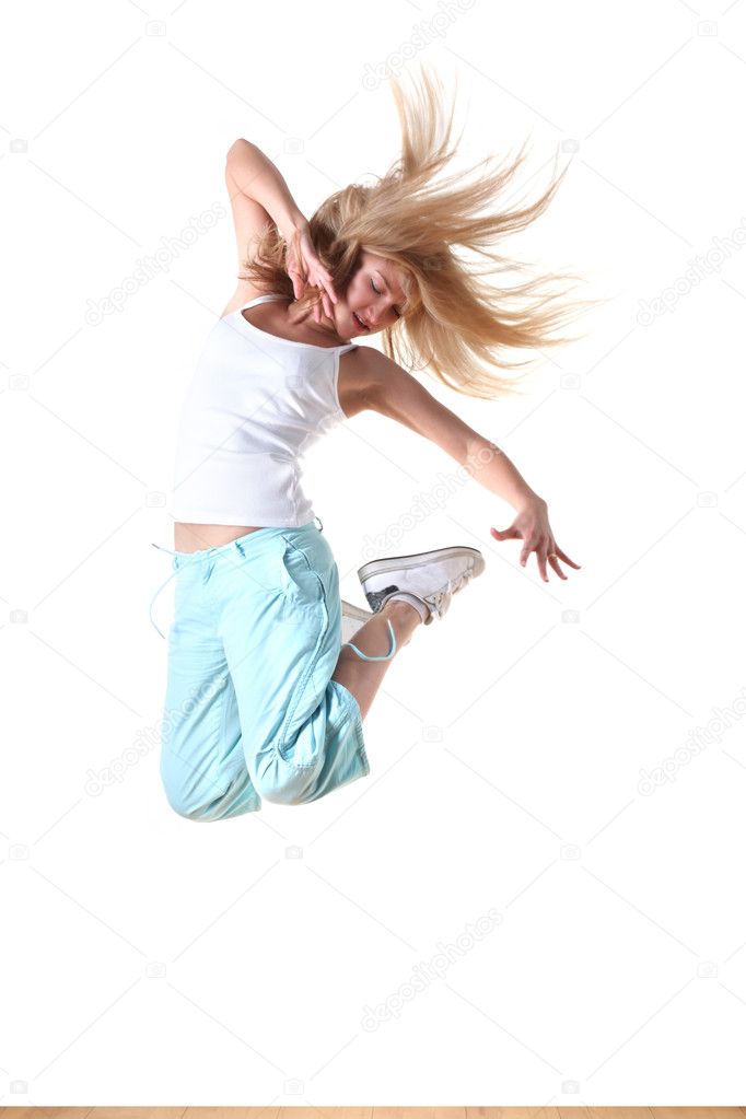 Jumping woman modern sport dancer in ballroom