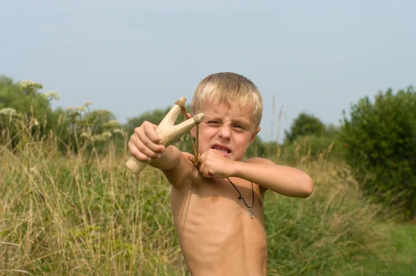 Boy with a slingshot. — Stock Photo, Image