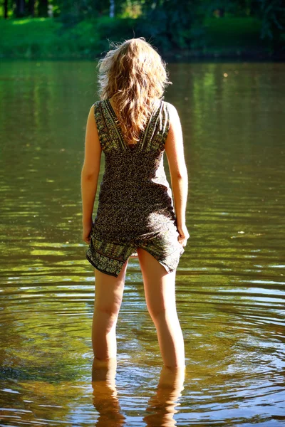 stock image Girl stand in river