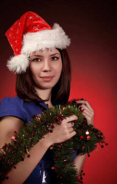 Vánoční dívka v santa klobouk — Stock fotografie