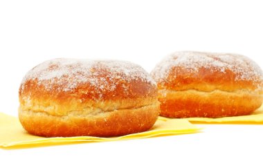 Two donuts in powdered sugar on paper napkins clipart