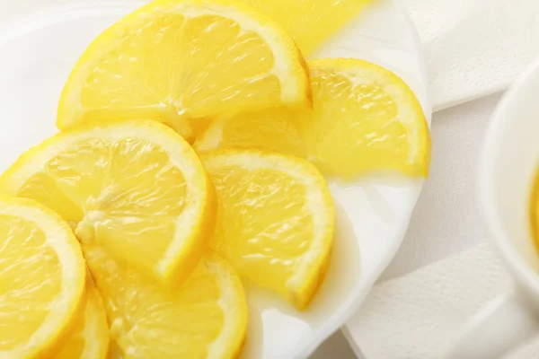 Lemon slices on a dish — Stock Photo, Image
