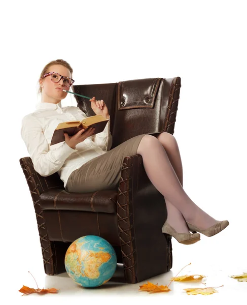 Female teacher sitting in armchair — Stock Photo, Image