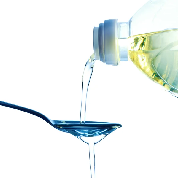 Pouring oil — Stock Photo, Image