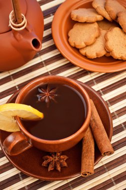 Tea with cinnamon sticks and star anise clipart