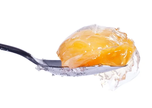 Mandarin in jelly on spoon — Stock Photo, Image