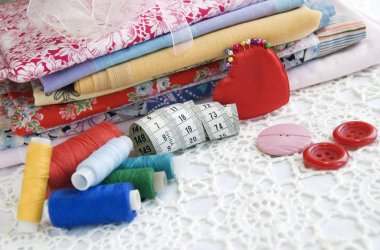 Colorful stuff for sewing at home, close up clipart