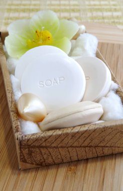Organic natural soaps in a spa-salon, a beauty-shop or in a bathroom, vertical, close up clipart