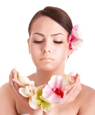 Beautiful girl with flower in spa. clipart