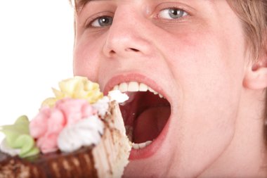 Man eating chocolate cake. clipart