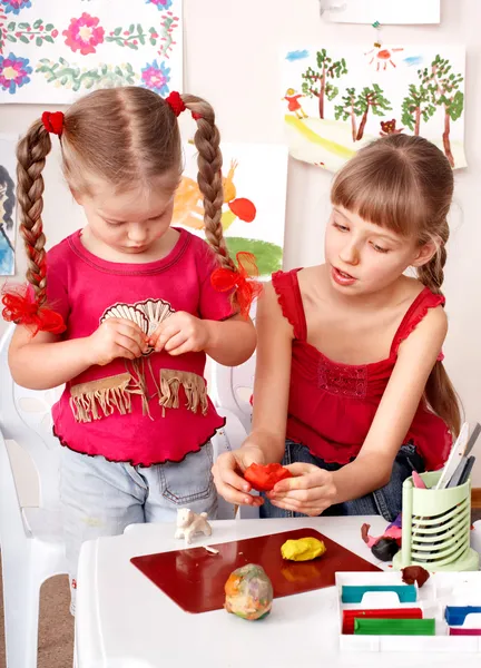 Children playing with plasticine. — Stock Photo, Image