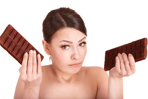 Beautiful girl eating chocolate bar. — Stock Photo, Image