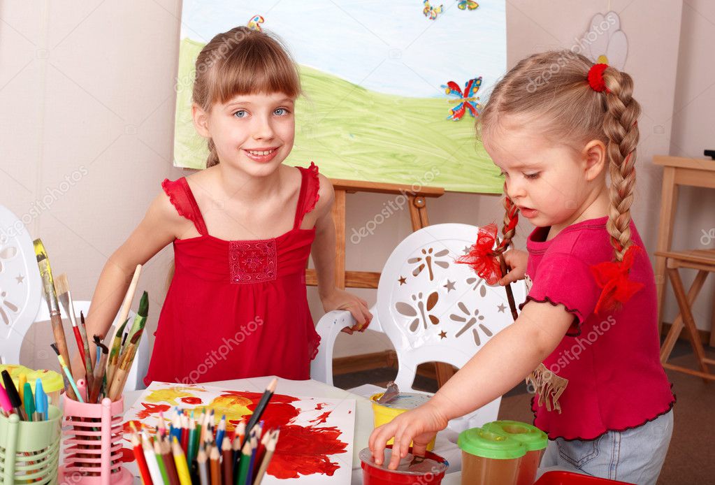 Children painting in art class.