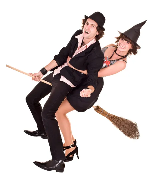 Halloween girl witch on broom bear man. — Stock Photo, Image