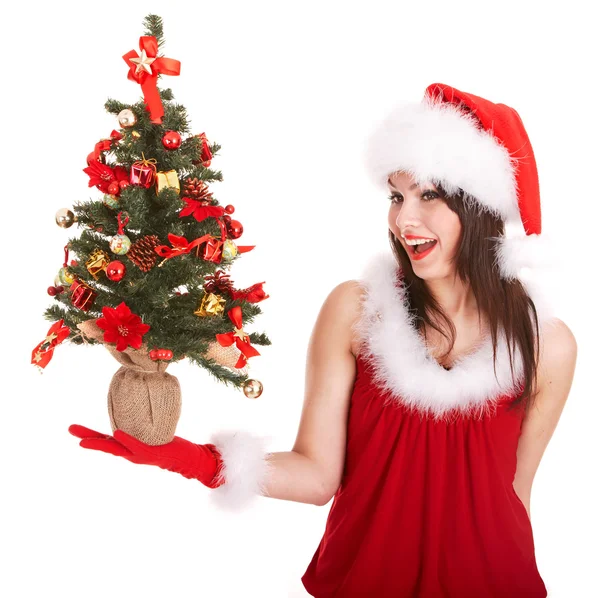 Chica de Navidad en sombrero de santa con pequeño árbol en la mano . — Foto de Stock