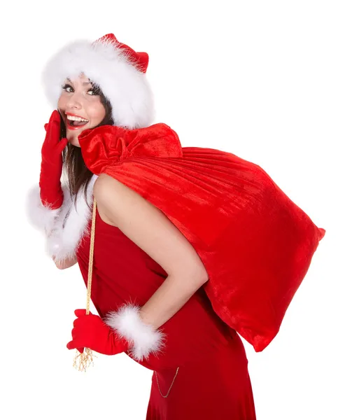 Noel hediye çanta ile Noel Baba şapkalı kız. — Stok fotoğraf