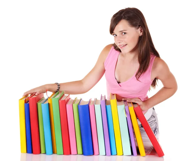 Dziewczyna z kolorowych kupie książki. — Zdjęcie stockowe