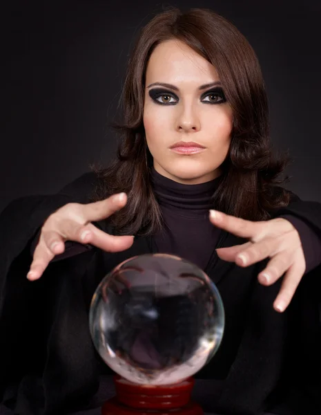 stock image Young woman with crystal ball.