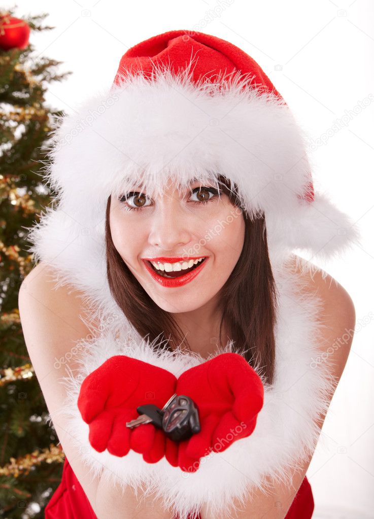 Christmas girl in santa hat with fir tree.