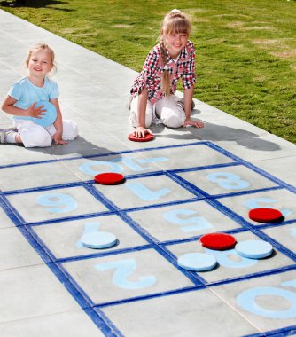 Little girl playing in park. clipart