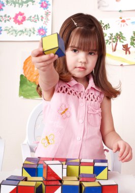 Child playing block at home. clipart