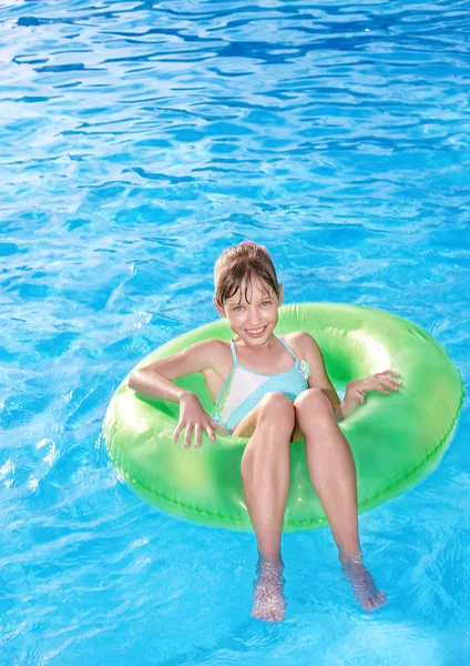 Child sitting on inflatable ring . — Stock Photo, Image