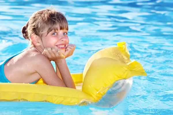 Child swimming on inflatable beach mattress. — Stock Photo, Image