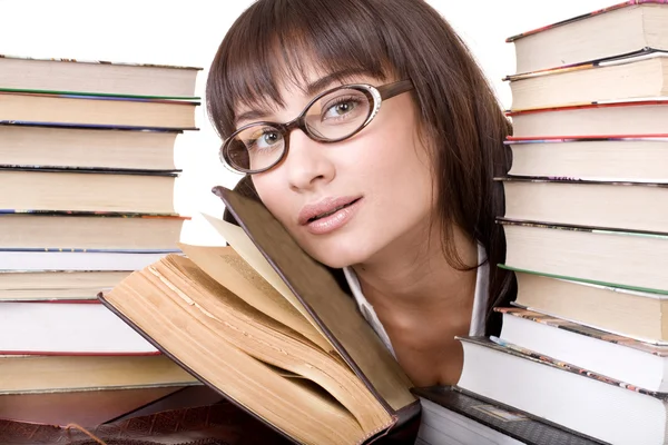 Chica inteligente con un montón de libros . — Foto de Stock