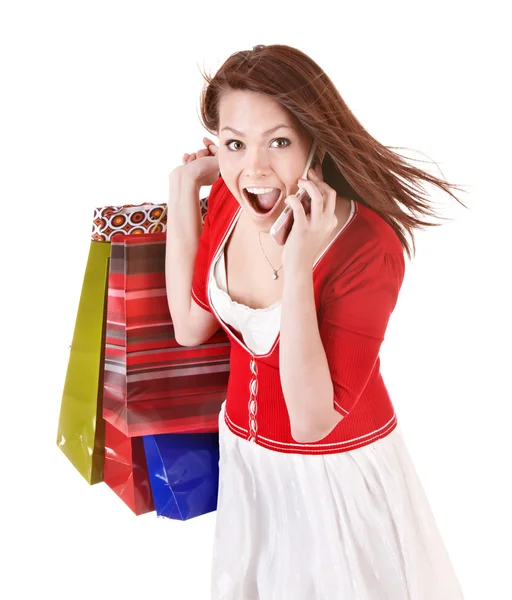 Lány hívás mobiltelefon a bevásárló szatyrok. — Stock Fotó